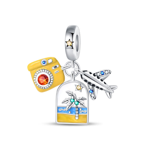 A triple-hanging pendant featuring an airplane, a yellow camera, and a backpack.