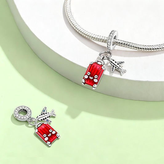 Airplane and red suitcase pendant